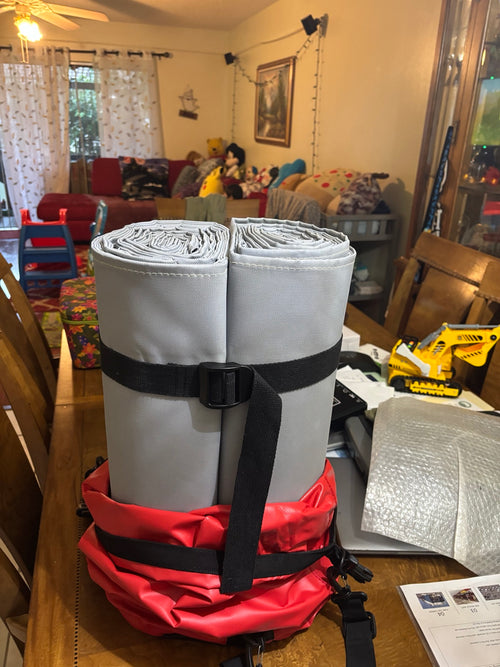 Inspected gray vehicle fire blanket folded in its carrying case