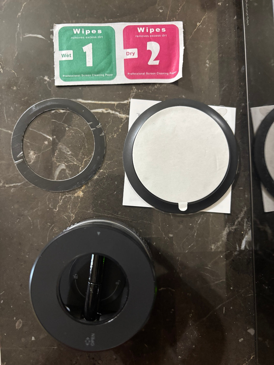 Received black K007 magnetic phone holder with rings and cleaning wipes